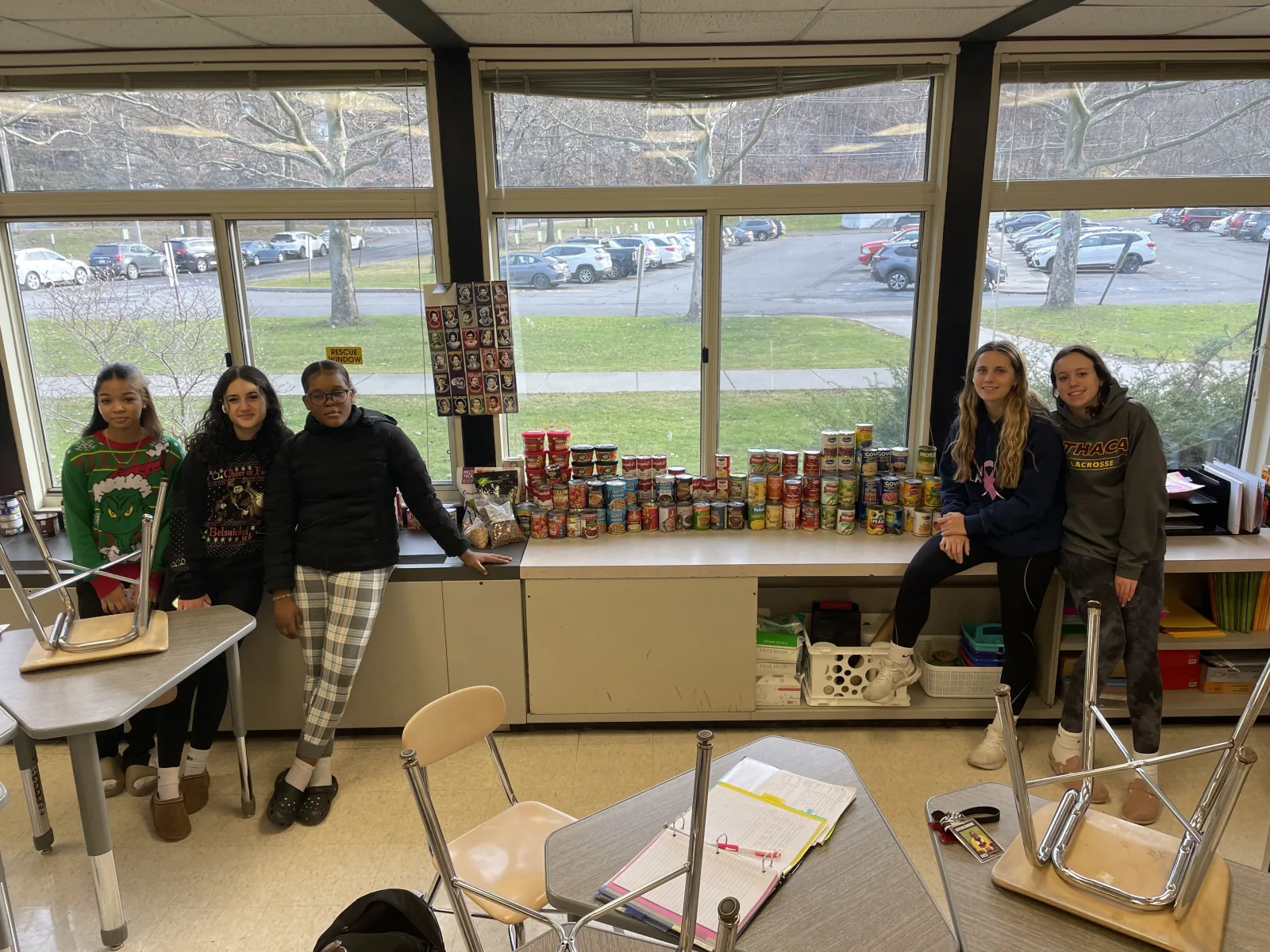 Students with the canned food drive their SLED chapter organized